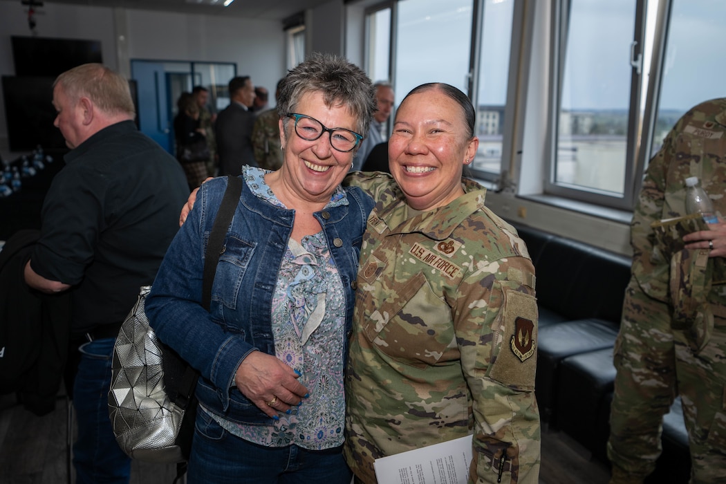 Two participants of the host nation forum pose for a picture.