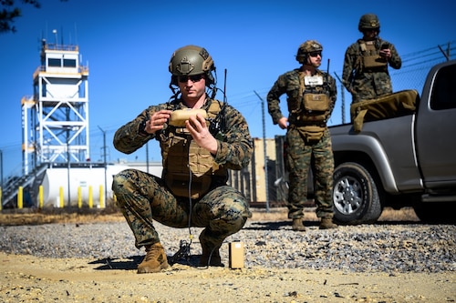 U.S. Marine Corps Staff Sgt. Hayden Sohmer (left), 25th Marine Regiment, 4th Marine Division, Marine Forces Reserve, joint terminal attack controller instructor, coordinates an air strike with an A-10 Thunderbolt II during a close air support exercise at Warren Grove Training Range, N.J., March 11, 2025. JTACs assigned to the 25th Marine Regiment conducted a training for recertification, which included both live target coordinated air and artillery strikes. A JTAC is a qualified service member who directs the action of military assets engaged in close land and air support during offensive operations from a forward position. (U.S. Air Force photo by Senior Airman Matt Porter)