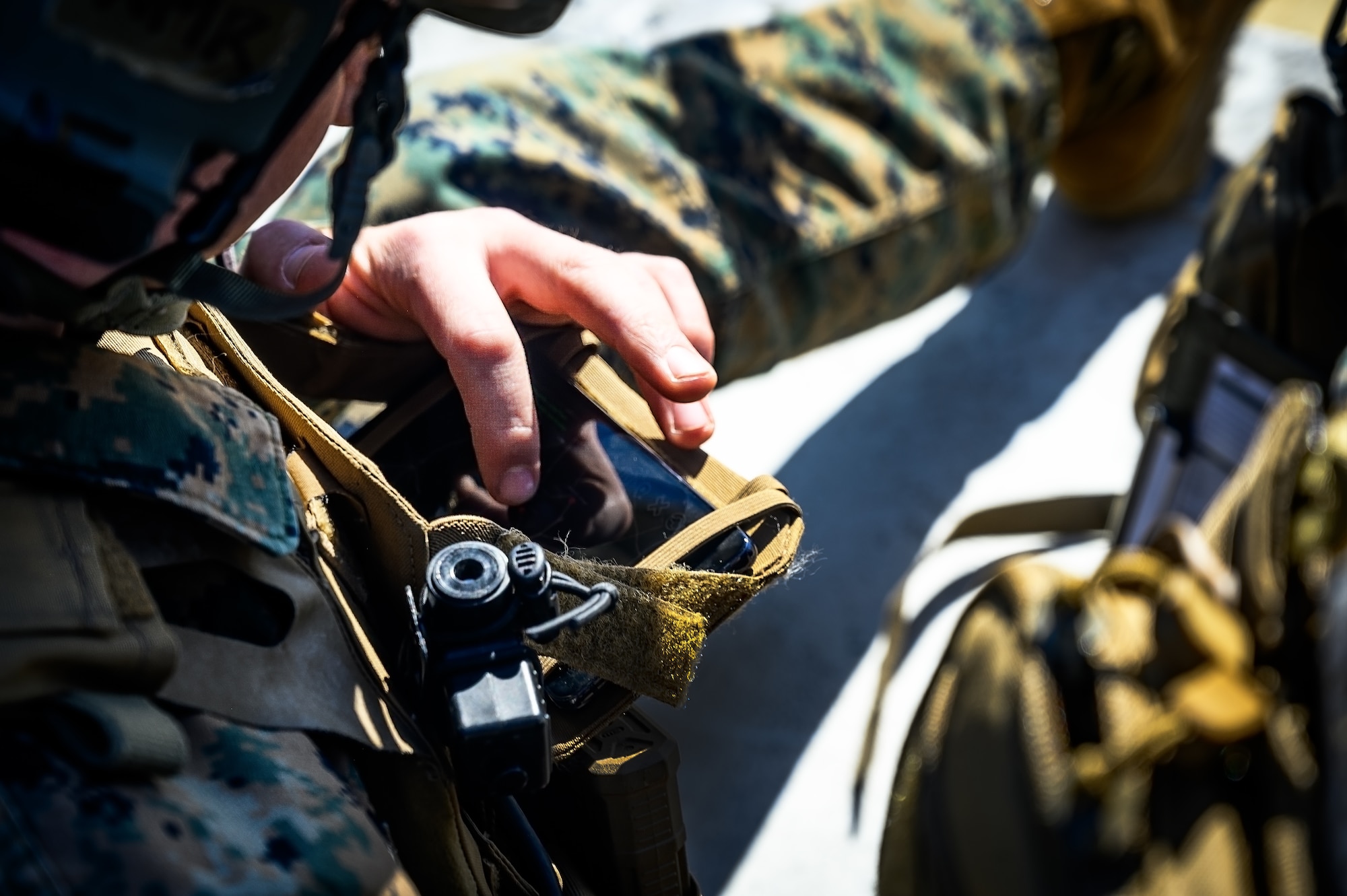 U.S. Marine Corps Sgt. Jay Westbrook, 25th Marine Regiment, 4th Marine Division, Marine Forces Reserve, joint terminal attack controller instructor, operates a digital land navigation system during a close air support exercise at Warren Grove Training Range, N.J., March 11, 2025. JTACs assigned to the 25th Marine Regiment conducted a training for recertification, which included both live target coordinated air and artillery strikes. A JTAC is a qualified service member who directs the action of military assets engaged in close land and air support for offensive operations from a forward position. (U.S. Air Force photo by Senior Airman Matt Porter)