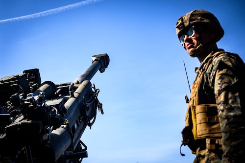 U.S. Marine Corps Sgt. Aiden Bunn, 25th Marine Regiment, 4th Marine Division, Marine Forces Reserve, fire support marine, supervises a live fire with an M777 howitzer during joint terminal attack controllers during a close air support exercise at Joint Base McGuire-Dix-Lakehurst, N.J., March 14, 2025. JTACs assigned to the 25th Marine Regiment conducted a training for recertification, which included both live target coordinated air and artillery strikes. A JTAC is a qualified service member who directs the action of military assets engaged in close land and air support for offensive operations from a forward position. (U.S. Air Force photo by Senior Airman Matt Porter)