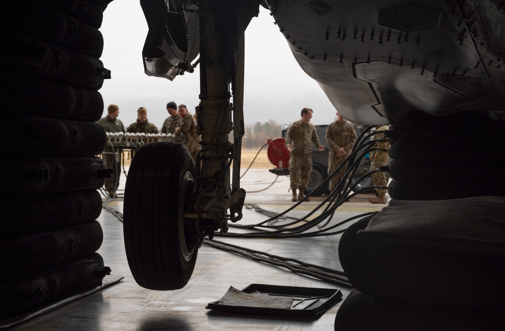 A photo of military members lifting an F-35 during a Crash Damage Recover course