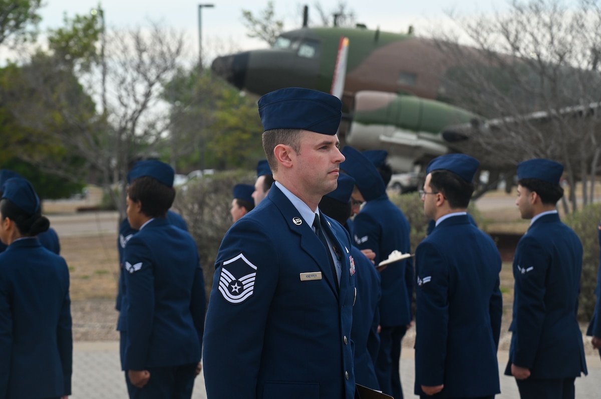 U.S. Air Force Master Sergeant Eric Knepper, 17th Force Support Squadron readiness senior noncommissioned officer, conducts an Open Ranks Inspection as part of a wing-wide Standards and Readiness Review outside the Norma Brown headquarters building, Goodfellow Air Force Base, Texas, March 26, 2025. The SRR was conducted at the squadron level so that leaders could have the opportunity to engage directly with their Airmen, facilitating accountability and solidifying a culture of professionalism. (U.S. Air Force photo by Airman 1st Class James Salellas)
