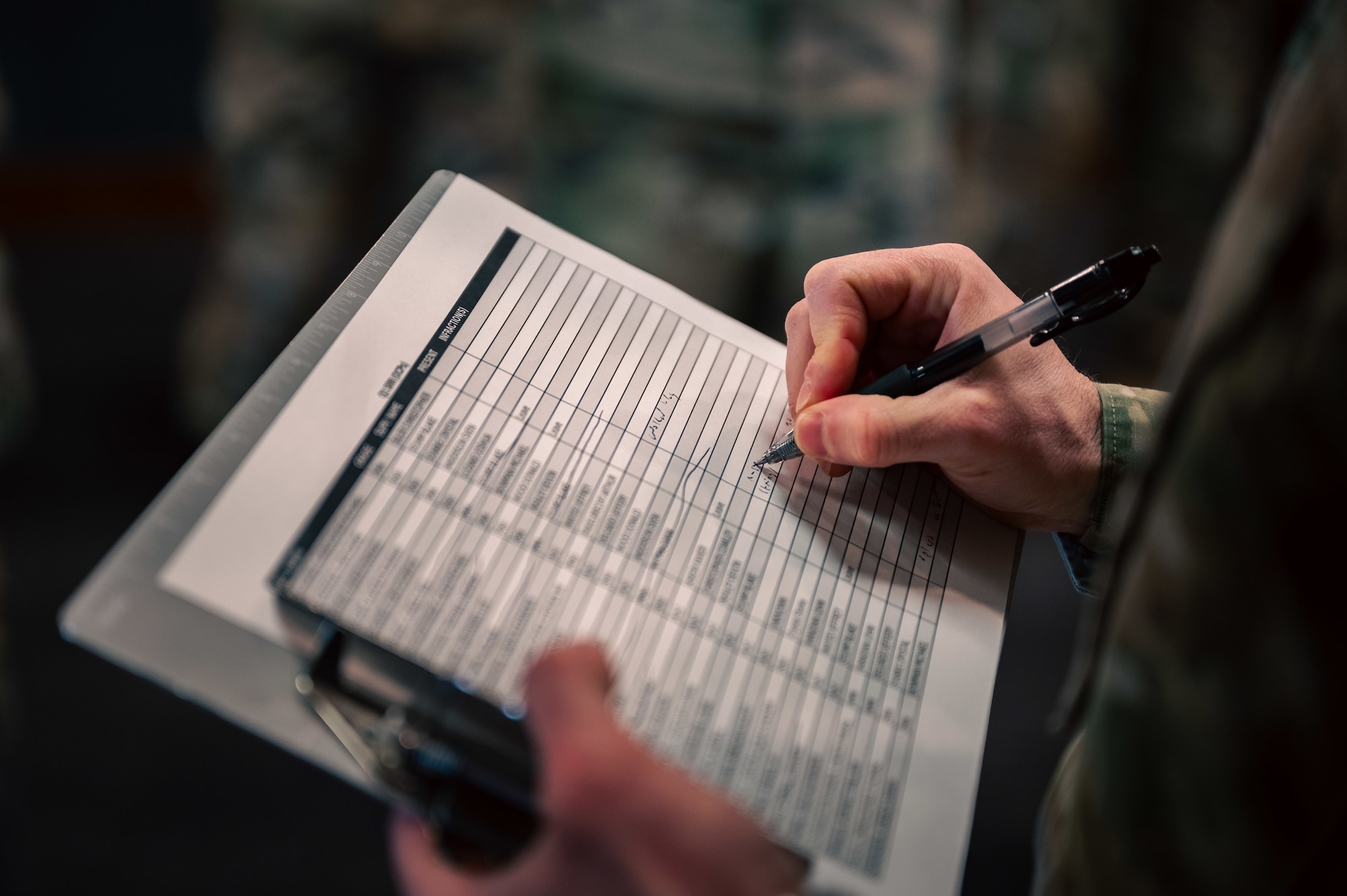 clipboard being written on up close.
