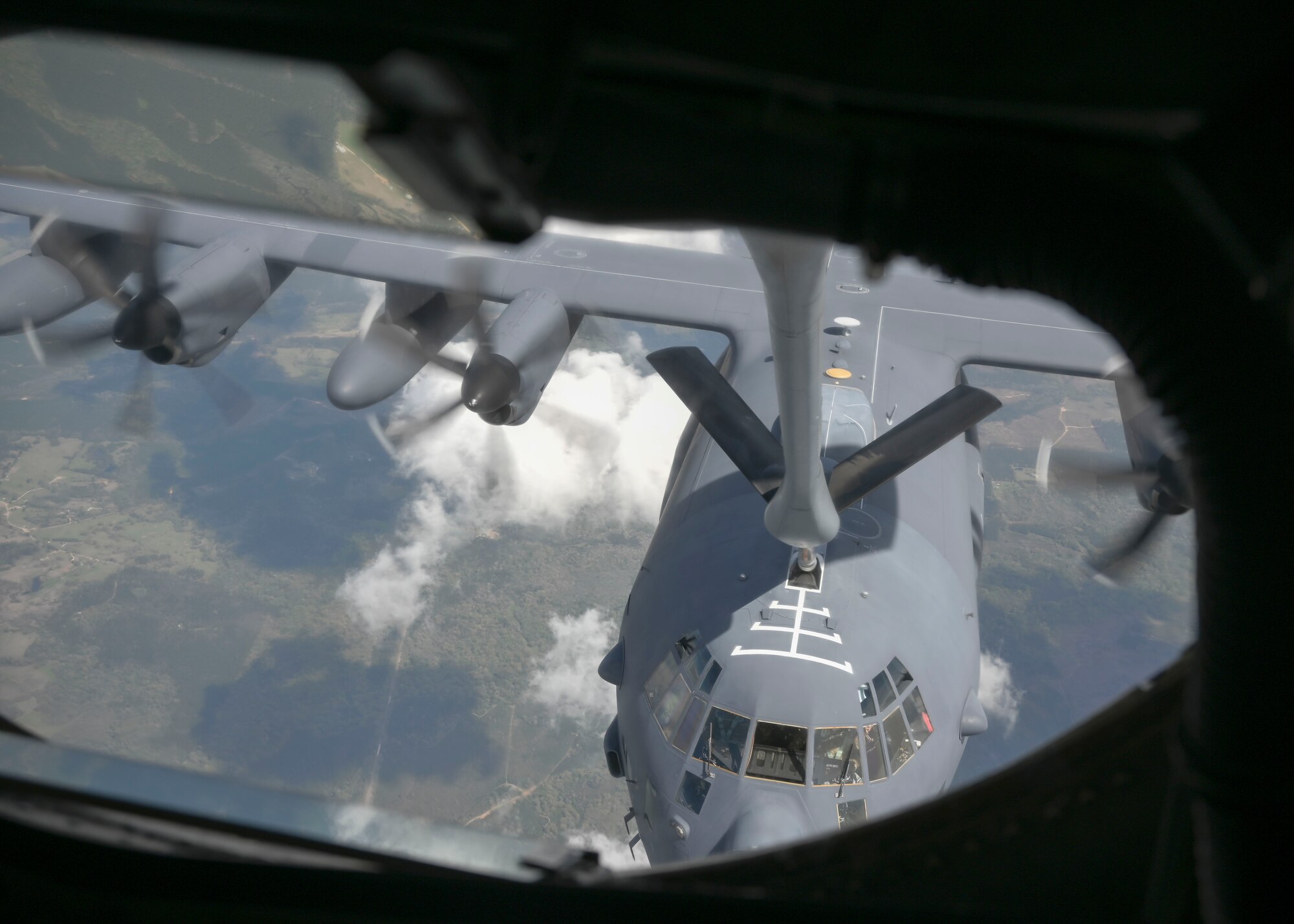 A military aircraft is aerial refueled by another military aircraft.