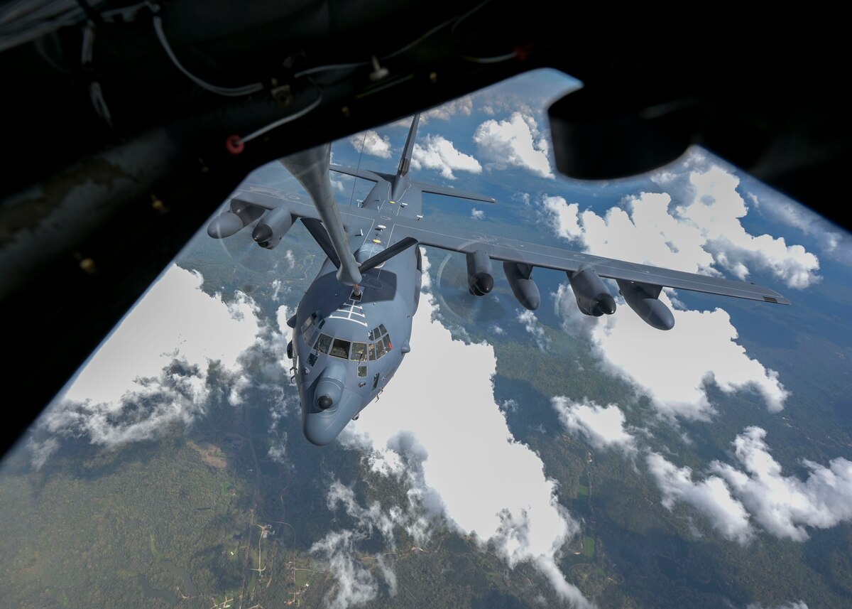 A military aircraft is aerial refueled by another military aircraft.