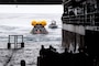 Sailors assigned to amphibious transport dock USS Somerset (LPD 25) and NASA engineers release a crew module test article from the ship’s well deck during NASA Underway Recovery Test 12 in the Pacific Ocean, March 26, 2025.