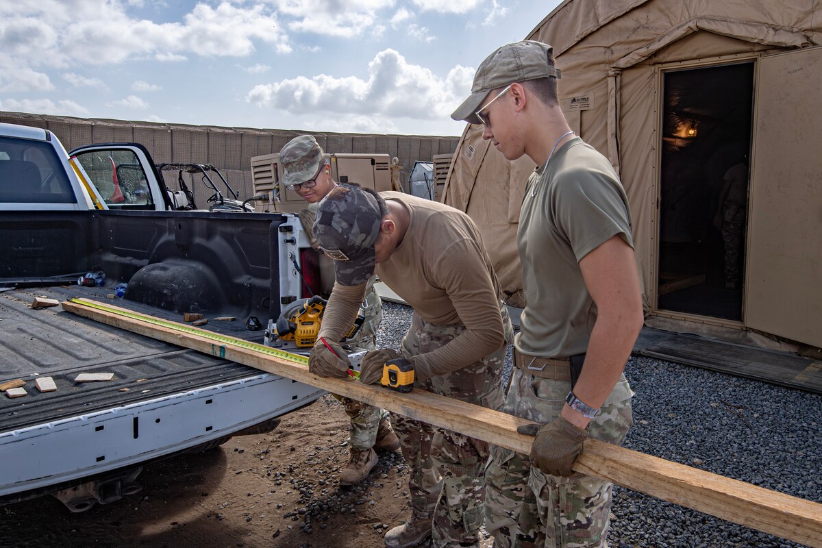 Members of the 475th Civil Engineer Flight collaborate on ongoing installation improvement projects