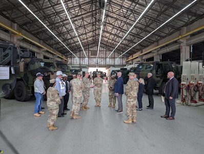 Army Lt. Col. Jonathan Neal, the commander of Army Field Support Battalion-Germany, briefs U.S. Army Europe and Africa Deputy Commanding General Lt. Gen. Sean Bernabe inside one of the facilities at the Coleman Army Prepositioned Stocks-2 worksite in Mannheim, Germany, March 25. (U.S. Army courtesy photo)