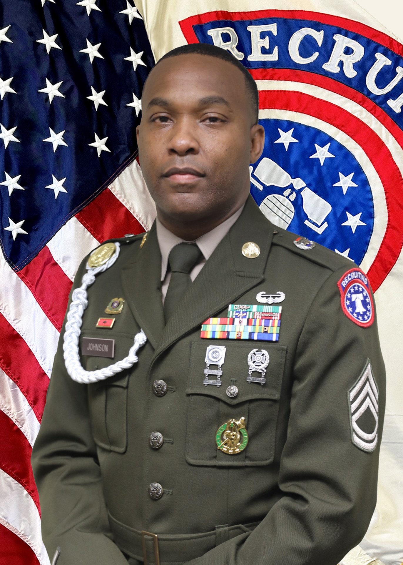 Male U.S. Army Soldier in uniform poses for headshot in front of U.S. Flag and USAREC Flag.