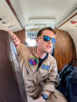 Naval Aircrewman Mechanical Second Class Aaron Combar gives a pre-flight safety brief aboard a C-12 aircraft at Naval Station Guantanamo Bay, March 27, 2025.