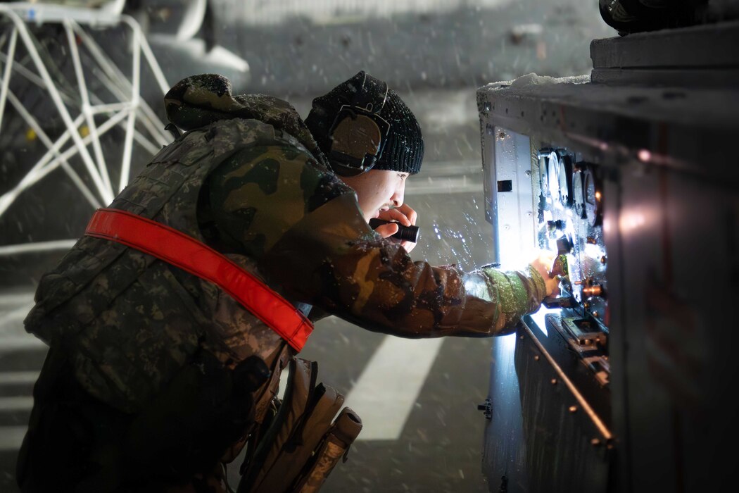 Airman working on machine