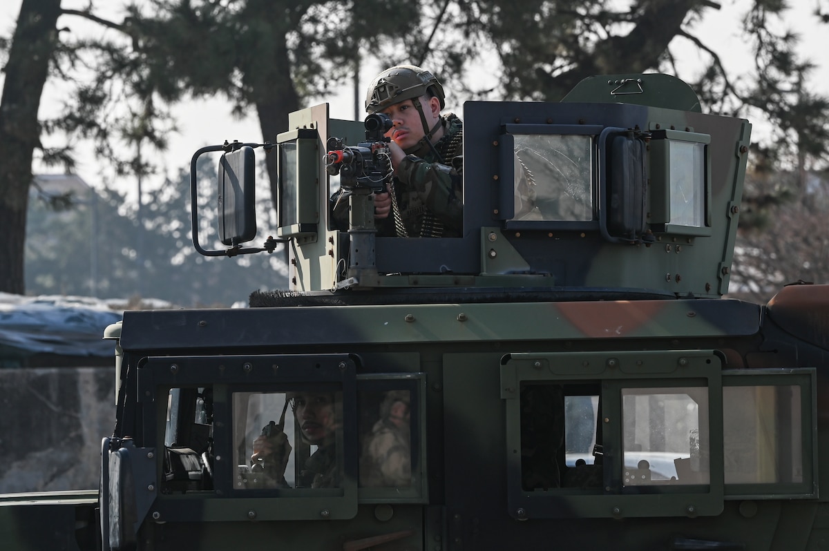Senior Airman Nathan Barbaza, 8th Security Forces Squadron response force leader, stands ready for action against opposing forces in a simulated ground attack training during exercise Freedom Shield 25 at Kunsan Air Base, South Korea, March 11, 2025. Airmen assigned to the 8th Fighter Wing participated in large-scale, realistic training to strengthen interoperability, reinforce the South Korea-U.S. combined defense posture and increase combat readiness. (U.S. Air Force photo by Senior Airman Maria Umanzor Guzman)