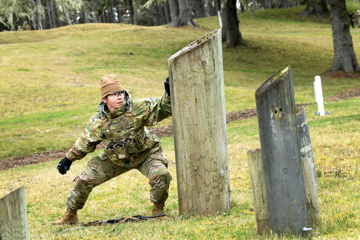 Senior Airman Alma Gomez, 173rd Fighter Wing, Oregon Air National Guard, navigates the grenade marksmanship course during the Oregon National Guard Best Warrior Competition at Camp Rilea, Ore., March 14, 2025. The full range of events assessed the warriors' physical fitness, land navigation skills, marksmanship and other battlefield scenarios. (Air National Guard photo by John Hughel)
