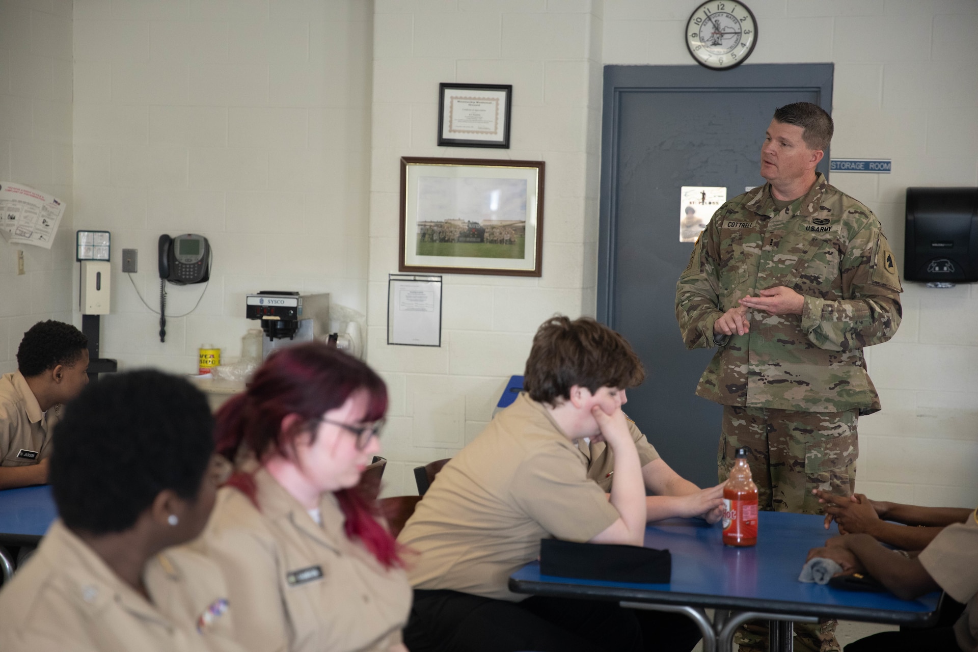 Chief Warrant Officer 3 William Cottrell speaks to students with Shawnee Academy’s JROTC program prior to their tour of the Kentucky Army National Guard’s Maneuver Area Training Equipment Site (MATES) at Fort Knox, Mar. 12. The students took part in a hands-on tour of the facilities. They explored maintenance shops, logistics areas, and got up close with military equipment. (U.S. Army National Guard photo by Milt Spalding)