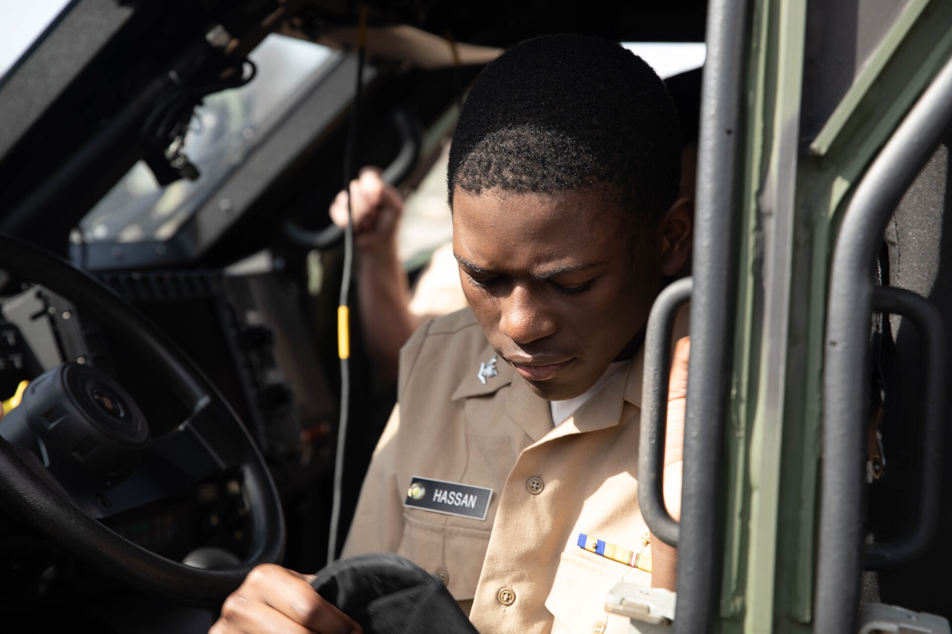 Students with Shawnee Academy’s JROTC program get up close and personal with military equipment during their tour of the Kentucky Army National Guard’s Maneuver Area Training Equipment Site (MATES) at Fort Knox, Mar. 12. The students took part in a hands-on tour of the facilities. They explored maintenance shops, logistics areas, and got up close with military equipment. (U.S. Army National Guard photo by Milt Spalding)