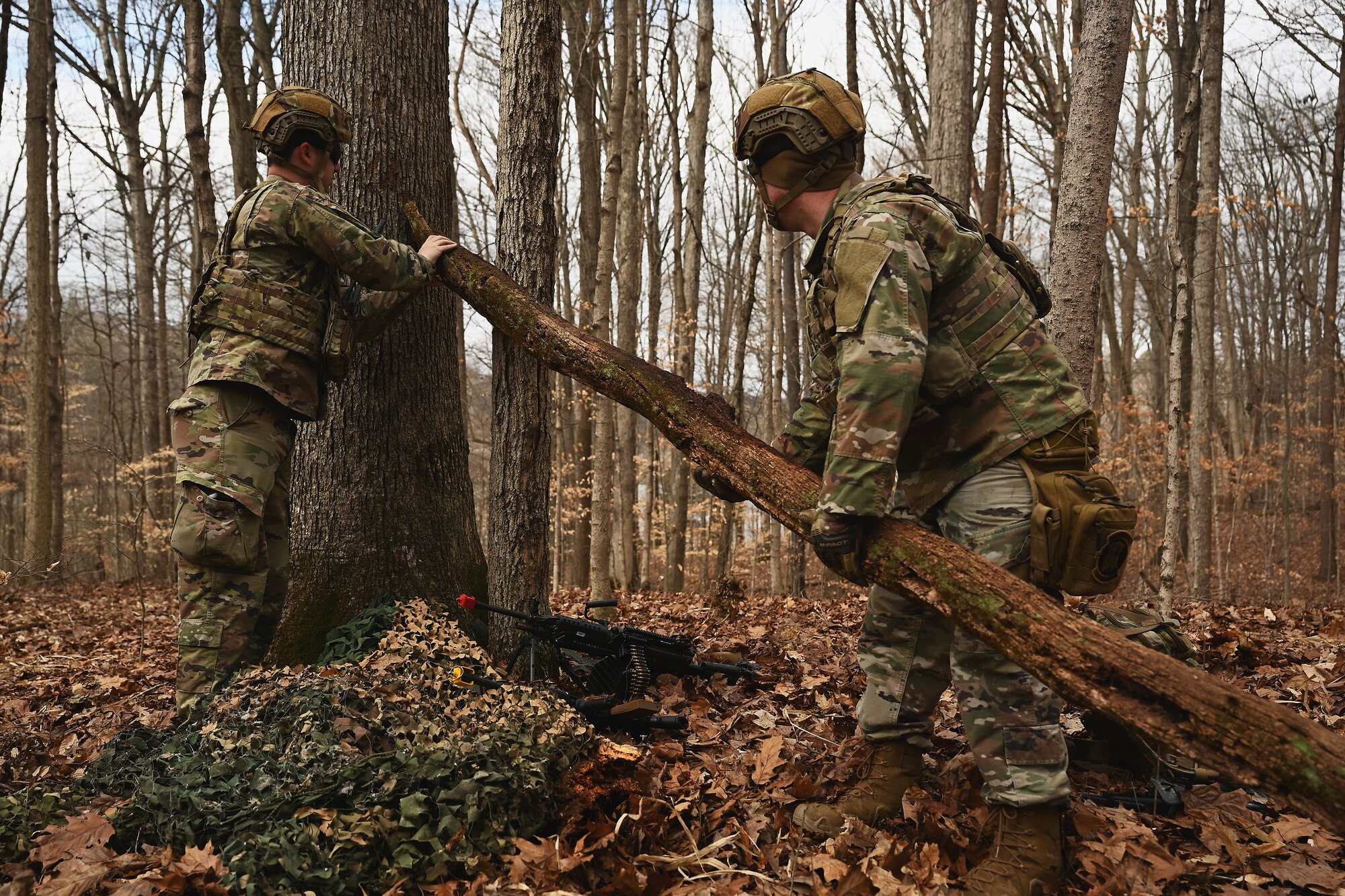U.S. Airmen assigned to the 178th Security Forces Squadron, Ohio Air National Guard build defensive fighting positions Feb. 4, 2025 during annual training at Camp Holland in Butlerville, Indiana. The training focused on operational unpredictability enabled through the agility of forces across pre-postured locations, increasing the number of locations an adversary must target. (U.S. Air National Guard photo by Shane Hughes)