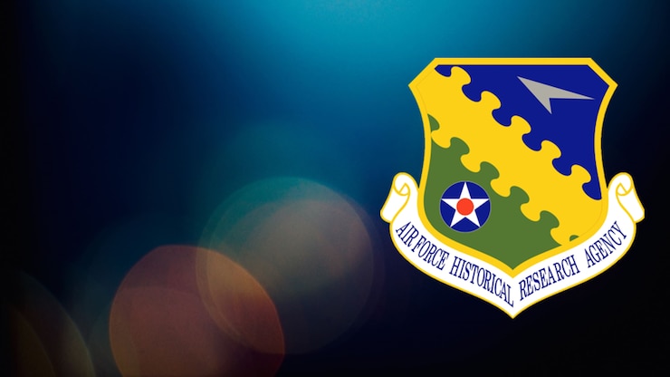 The emblem of the Air Force Historical Research Agency (AFHRA) is on the right, featuring a shield with a gray aircraft silhouette on a blue background, a yellow wavy line across the center, and a green section with a blue circle, white star, and red dot. Below the shield is a scroll reading 'AIR FORCE HISTORICAL RESEARCH AGENCY.'