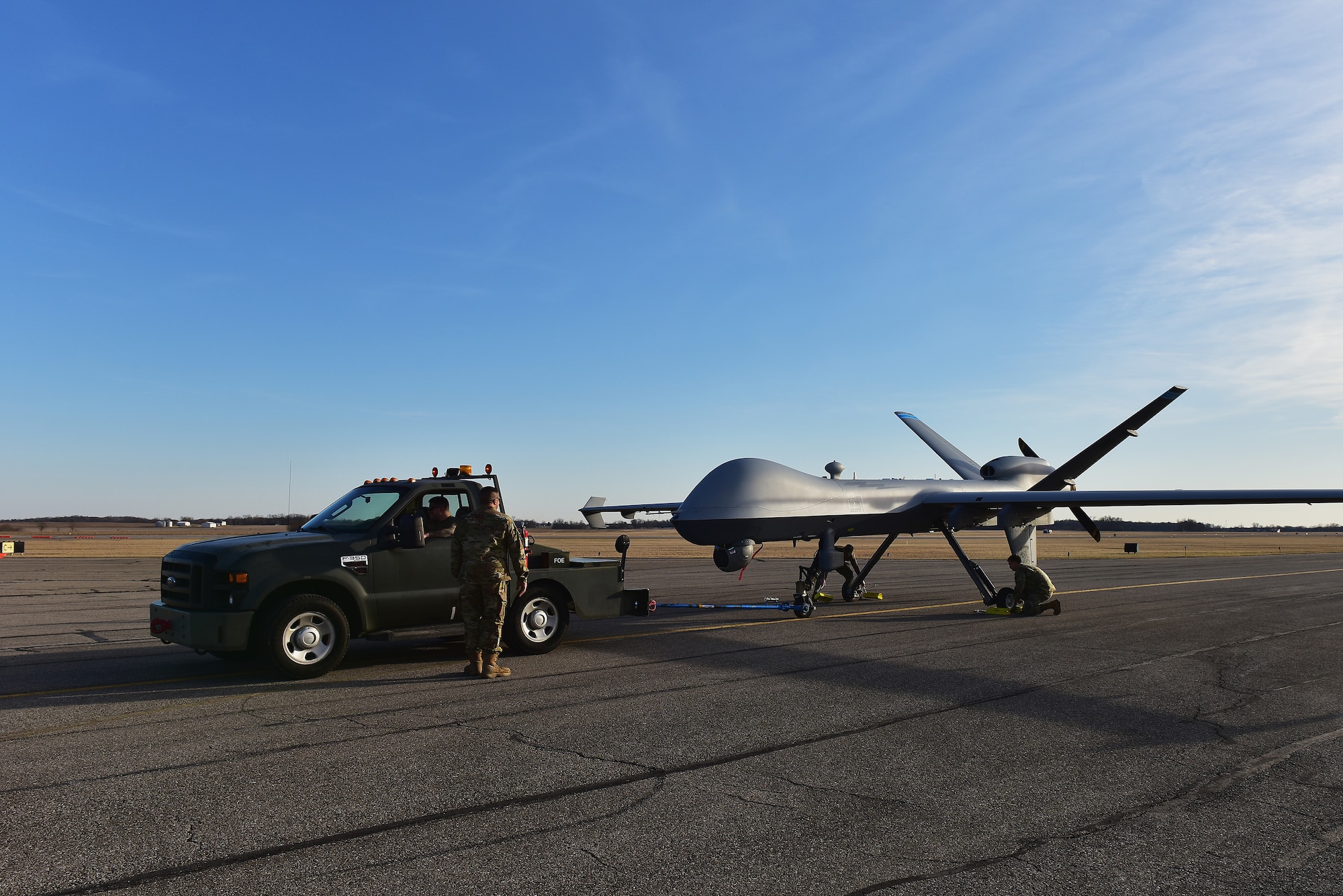 A U.S. Air Force MQ-9 Reaper sits on the taxiway Mar. 3, 2025 at Springfield-Beckley Air National Guard Base in Springfield, Ohio. The MQ-9 arrived for Advanced Wrath, a two-week exercise supporting U.S. Special Operations Command, U.S. Coast Guard search and rescue operations, and testing for the Air Force Research Laboratory. (U.S. Air National Guard photo by Shane Hughes)