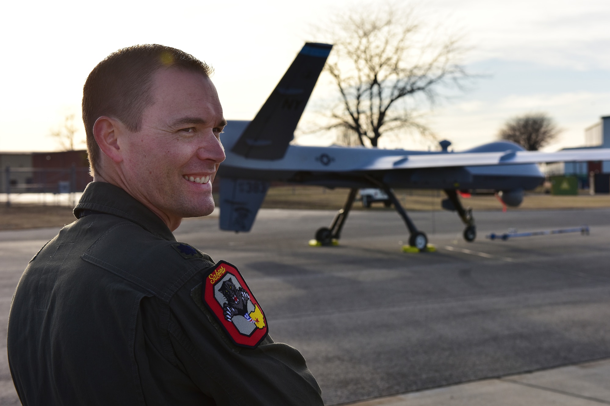 U.S. Air Force Lt. Col. Zach Eaton, commander of the Operations Support Squadron at the 178th Wing, Ohio Air National Guard, observes post-flight maintenance on an MQ-9 Reaper on Mar. 10, 2025  at Springfield-Beckley Air National Guard Base in Springfield, Ohio. The MQ-9 arrived for Advanced Wrath, a two-week exercise supporting U.S. Special Operations Command, U.S. Coast Guard search and rescue operations, and testing for the Air Force Research Laboratory. (U.S. Air National Guard photo by Shane Hughes)