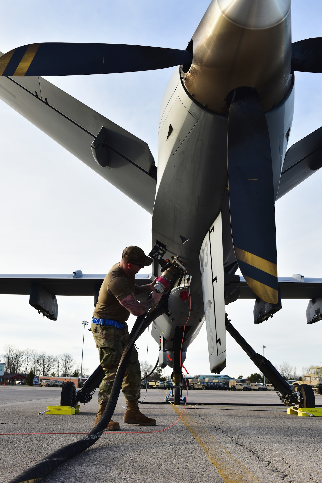 U.S. Air Force Tech. Sgt. Brien Disbro, a crew chief assigned to the174th Attack Wing, performs post-flight maintenance on an MQ-9 Reaper on Mar. 10, 2025  at Springfield-Beckley Air National Guard Base in Springfield, Ohio. The MQ-9 arrived for Advanced Wrath, a two-week exercise supporting U.S. Special Operations Command, U.S. Coast Guard search and rescue operations, and testing for the Air Force Research Laboratory. (U.S. Air National Guard photo by Shane Hughes)