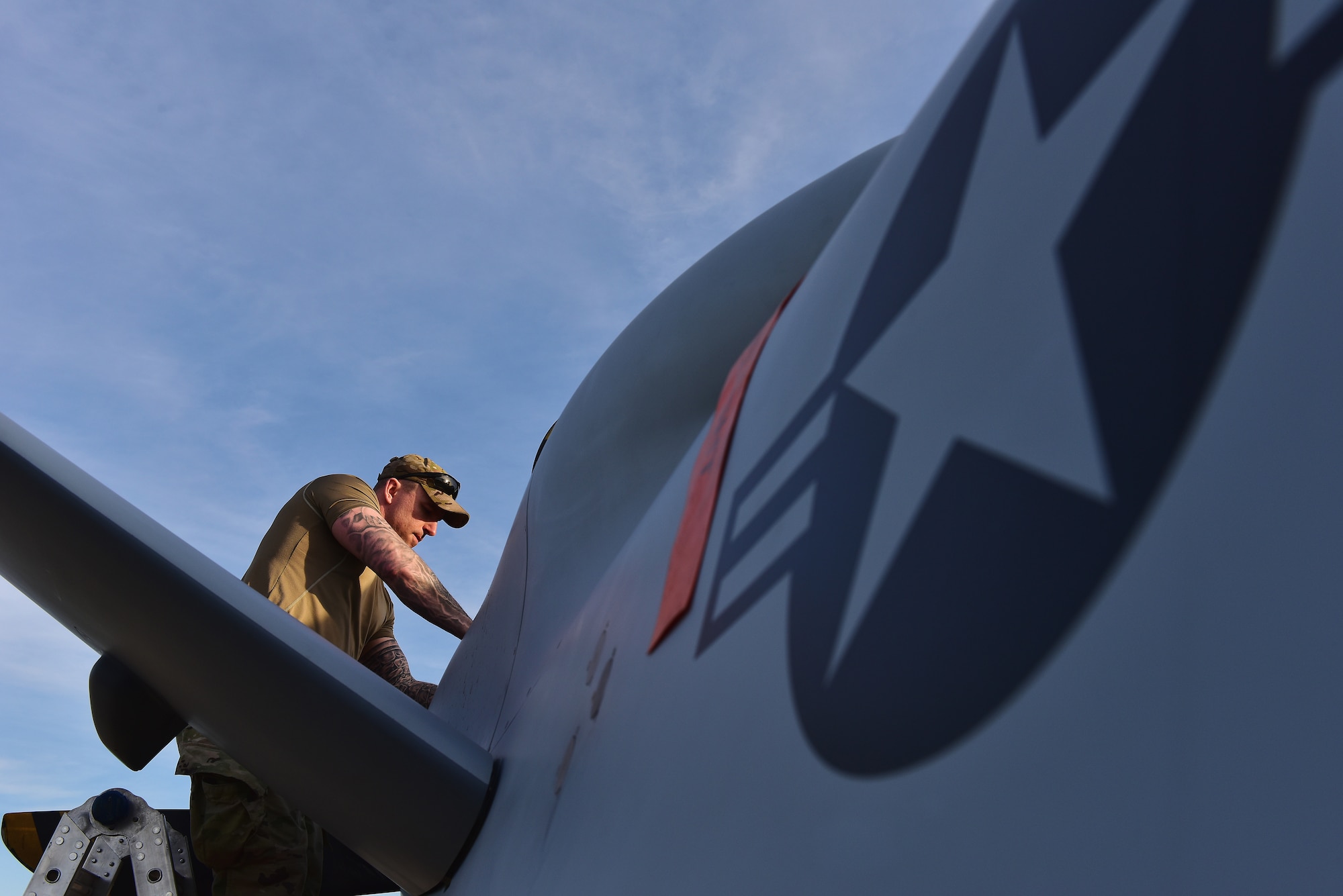 U.S. Air Force Tech. Sgt. Brien Disbro, a crew chief assigned to the174th Attack Wing, performs post-flight maintenance on an MQ-9 Reaper on Mar. 10, 2025  at Springfield-Beckley Air National Guard Base in Springfield, Ohio. The MQ-9 arrived for Advanced Wrath, a two-week exercise supporting U.S. Special Operations Command, U.S. Coast Guard search and rescue operations, and testing for the Air Force Research Laboratory. (U.S. Air National Guard photo by Shane Hughes)