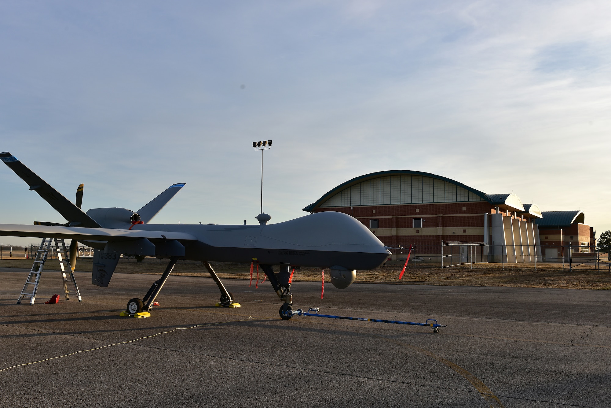 A U.S. Air Force MQ-9 Reaper sits on the taxiway Mar. 3, 2025 at Springfield-Beckley Air National Guard Base in Springfield, Ohio. The MQ-9 arrived for Advanced Wrath, a two-week exercise supporting U.S. Special Operations Command, U.S. Coast Guard search and rescue operations, and testing for the Air Force Research Laboratory. (U.S. Air National Guard photo by Shane Hughes)