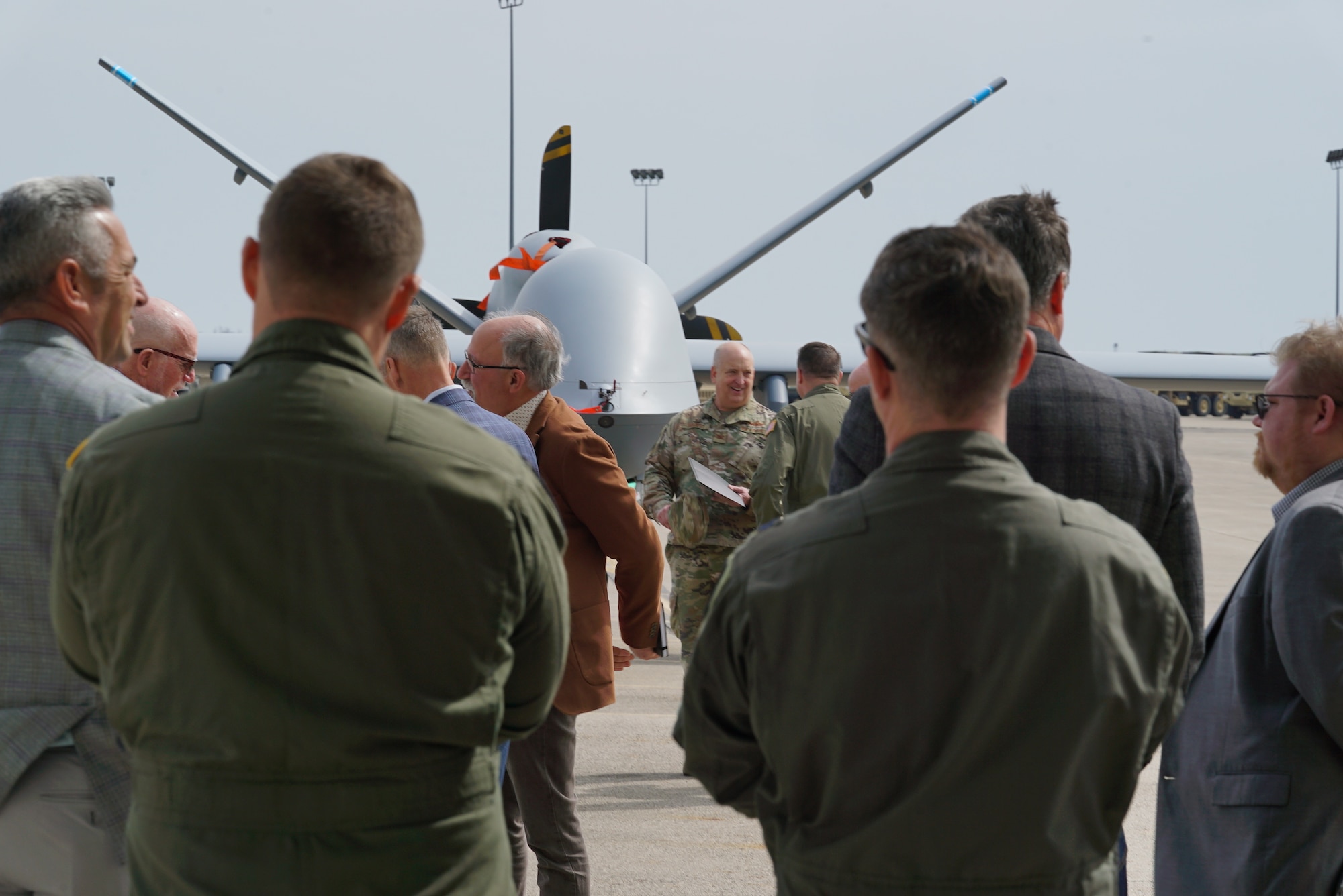 Service members, community leaders and media view and learn about the MQ-9 Reaper during the 2025 Advanced Wrath Distinguished Visitor and Industry Leader Day, at Springfield Air National Guard base, 19 March, 2025. Exercise Advanced Wrath is a collaborative training exercise bringing together the 178th Wing, the 174th Attack Wing, Syracuse, New York. This capability not only expands the lethality of the 178th Wing but also highlights its ability to provide support in contested environments. (U.S. Air National Guard photo by Staff Sgt. Jillian Maynus, 178th Wing)