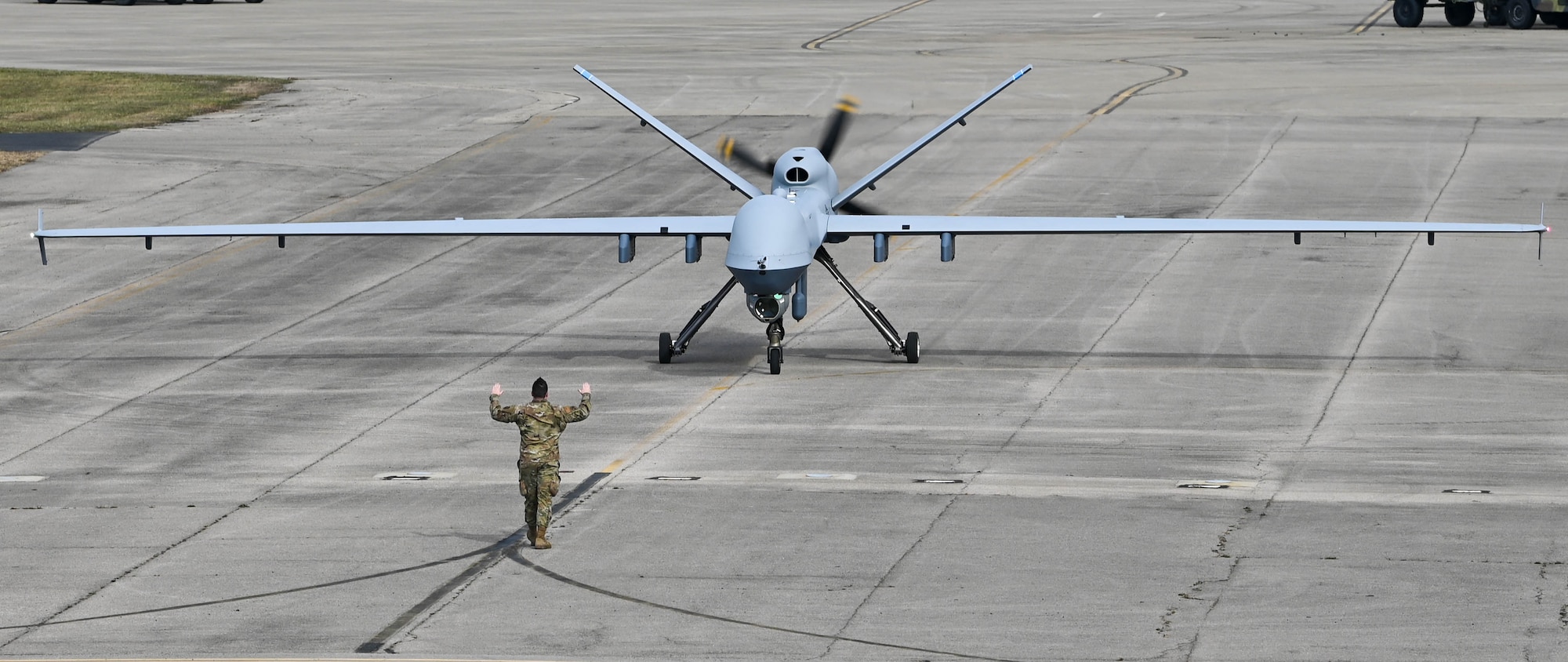 An MQ-9 Reaper assigned to the 178th Wing taxis to the runway to participate in a close formation taxi commonly known as an "elephant walk", on Springfield-Beckley Air National Guard Base, March 19, 2024. The elephant walk demonstrated the 178th Wing's rapid mobility capabilities and real-world response readiness. (U.S. Air National Guard photo by Airman 1st Class Josh Kaeser)