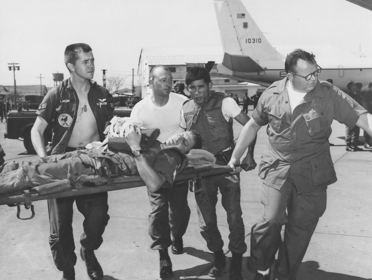 Historical image of Airmen carrying a patent.