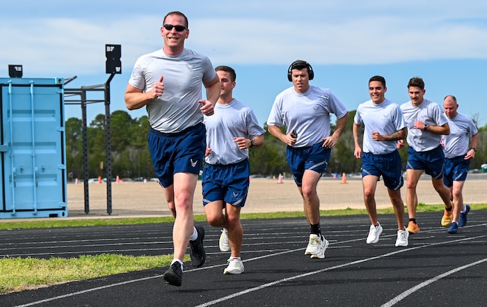 U.S. Airmen from the 42nd Contracting Squadron run during unit physical training at Maxwell Air Force Base, Alabama, March 26, 2025.