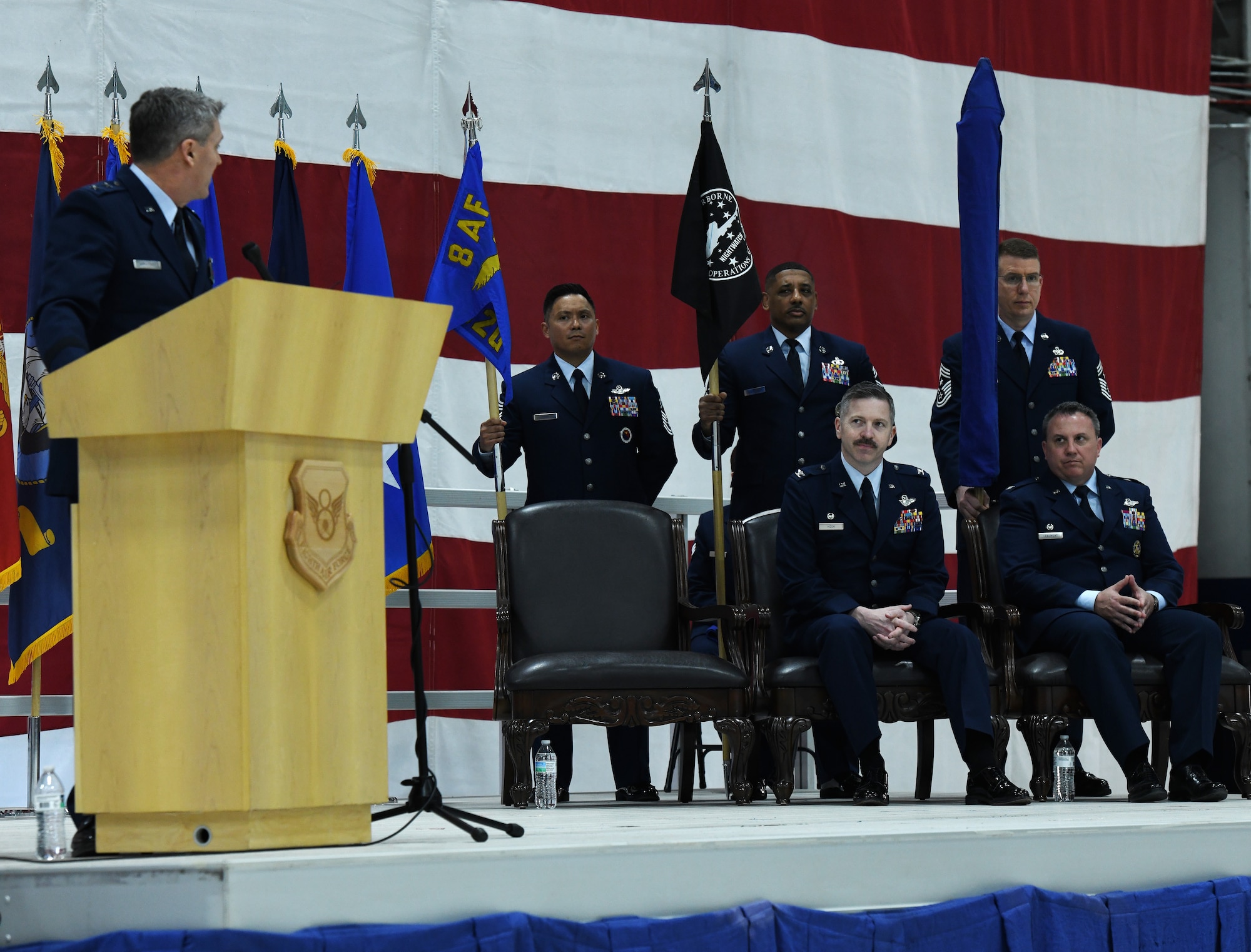 Maj. Gen. Jason Armagost speaks to Col. Patrick Hook, 595th Command and Control Group commander, and Col. David Leaumont, incoming 95th Wing commander, during the 95th Wing activation ceremony.