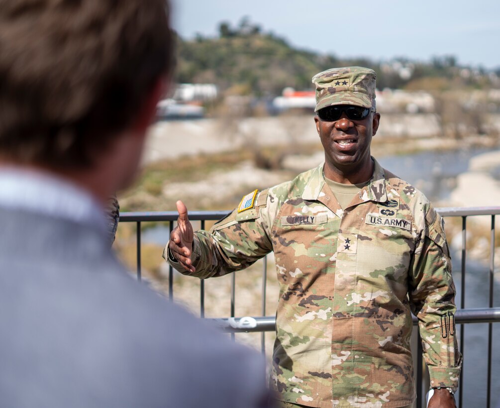Maj. Gen. Jason Kelly, U.S. Army Corps of Engineers deputy commanding general for Civil and Emergency Operations, right, speaks with Edward Belden, Los Angeles River Ecosystem Restoration Project manager for the City of LA, during a Feb. 27 stop on the pedestrian bridge over Reach 6 of the LA River, next to LA’s historic Taylor Yard. Kelly was there with a group of leaders including Robyn Colosimo, senior official performing the duties of the assistant secretary of the Army for Civil Works; Joseph Savage, programs director with USACE South Pacific Division; Col. Andrew Baker, LA District commander; and Justin Gay, LA District deputy district engineer, to talk with City of Los Angeles officials about the status and direction of the project.