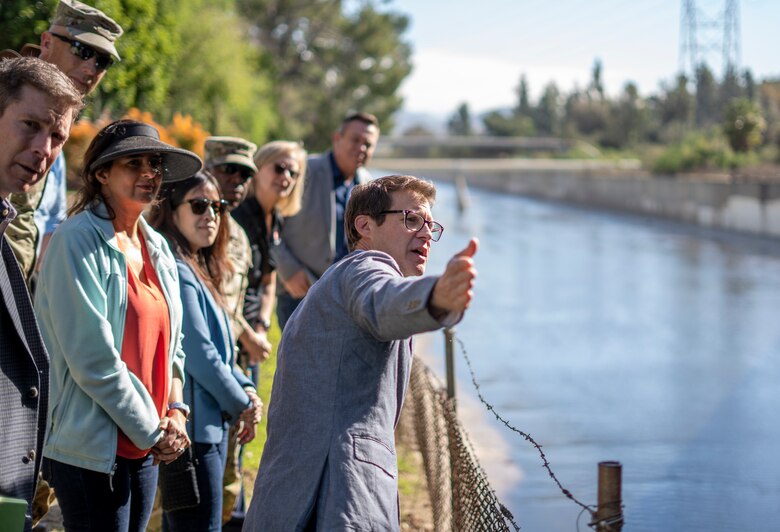 Edward Belden, Los Angeles River Ecosystem Restoration Project manager for the City of LA, right, directs a visiting group’s attention to a point of interest Feb. 27 along Reach 1 of the LA River. The group included Robyn Colosimo, senior official performing the duties of the assistant secretary of the Army for Civil Works; Maj. Gen. Jason Kelly, U.S. Army Corps of Engineers deputy commanding general for Civil and Emergency Operations; Joseph Savage, programs director with USACE South Pacific Division; Col. Andrew Baker, LA District commander; and Justin Gay, LA District deputy district engineer; and Priyanka Wadhawan, project manager with the LA District’s Mega Projects Division.