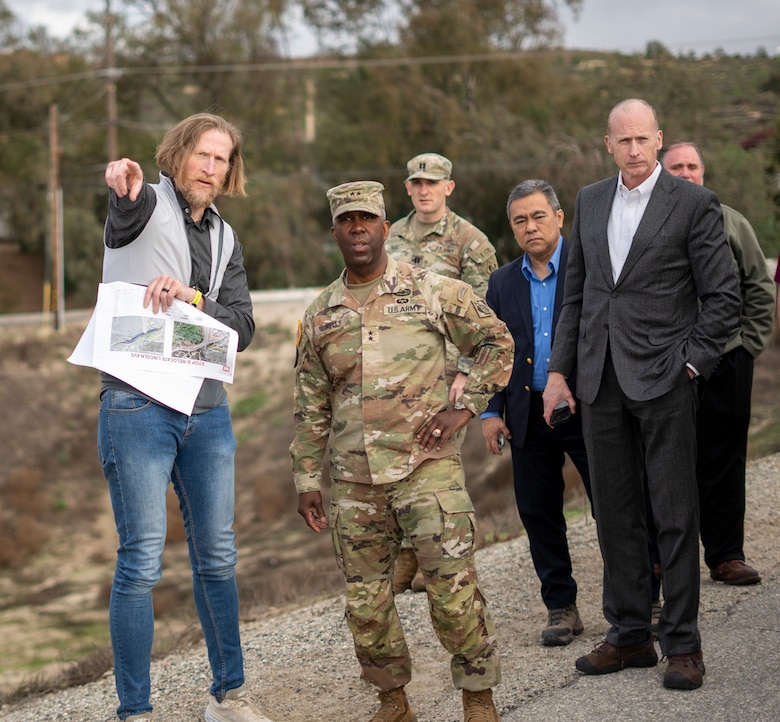 Aaron Smith, senior dam safety adviser with the U.S. Army Corps of Engineers, left, points out key features of Whittier Narrows Dam to Maj. Gen. Jason Kelly, USACE deputy commanding general for Civil Works and Emergency Operations, second from left, during his March 4 tour of the dam in Montebello, California. Kelly was accompanied by fellow USACE leaders and subject-matter experts from both the Los Angeles and Tulsa districts, as well as the South Pacific and Southwestern divisions.