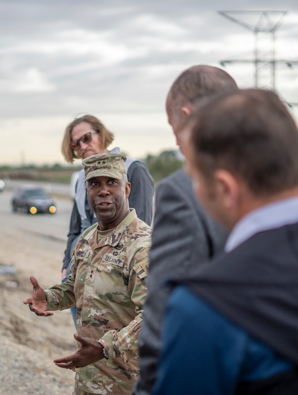 Maj. Gen. Jason Kelly, U.S. Army Corps of Engineers deputy commanding general for Civil Works and Emergency Operations, center-left, talks with fellow USACE leaders and subject-matter experts during his March 4 tour of Whittier Narrows Dam in Montebello, California.