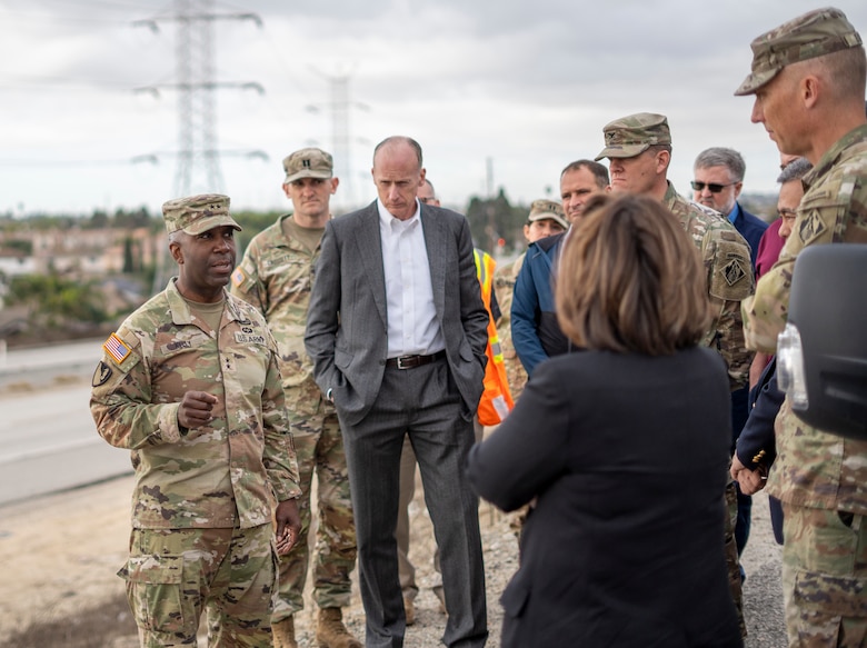 Maj. Gen. Jason Kelly, U.S. Army Corps of Engineers deputy commanding general for Civil Works and Emergency Operations, left, talks with fellow USACE leaders and subject-matter experts during his March 4 tour of Whittier Narrows Dam in Montebello, California.