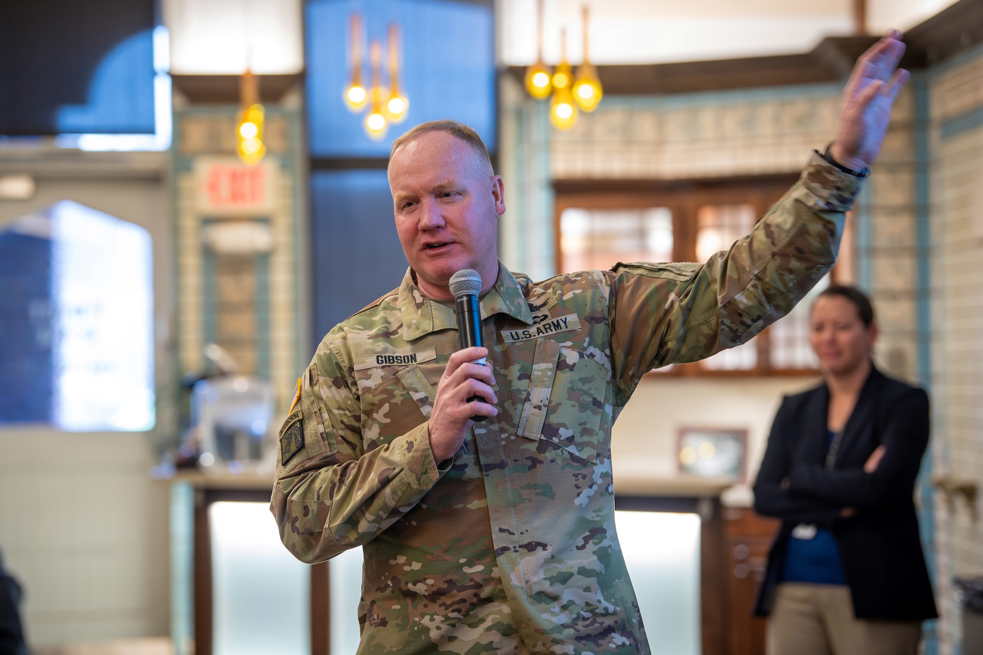 A US Army General speaks to an audience of international military leaders