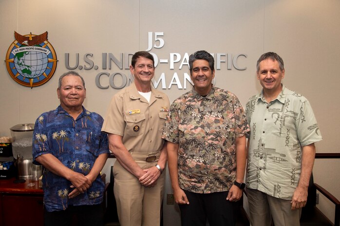Rear Adm. Gregory Huffman, commander of Joint Task Force - Micronesia, joins Surangel Whipps Jr., President of the Republic of Palau, for a group photo during the biannual Joint Committee Meeting at the U.S. Indo-Pacific Command Headquarters, Camp H.M. Smith, Hawaii, March 27, 2025.