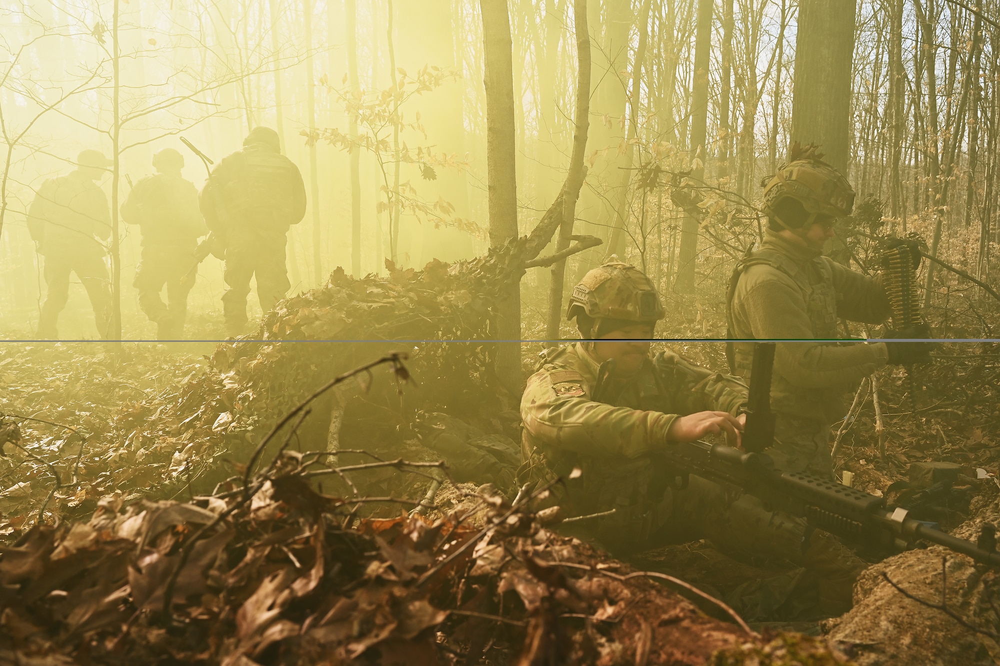 U.S. Airmen assigned to the 178th Security Forces Squadron, Ohio National Guard defend their fighting position against a simulated enemy attack Feb. 4, 2025 during annual training at Camp Holland in Butlerville, Indiana. The training, primarily focused on mission planning, included attacking and defending positions and aligning tactics with the Air Force doctrine of Agile Combat Employment. (U.S. Air National Guard photo by Shane Hughes)