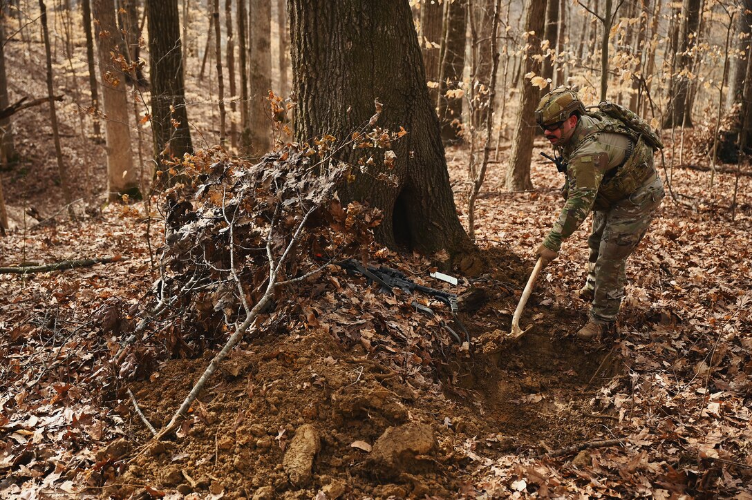 A U.S. Airman assigned to the 178th Security Forces Squadron, Ohio Air National Guard build defensive fighting positions Feb. 4, 2025 during annual training at Camp Holland in Butlerville, Indiana. The training focused on operational unpredictability enabled through the agility of forces across pre-postured locations, increasing the number of locations an adversary must target. (U.S. Air National Guard photo by Shane Hughes)