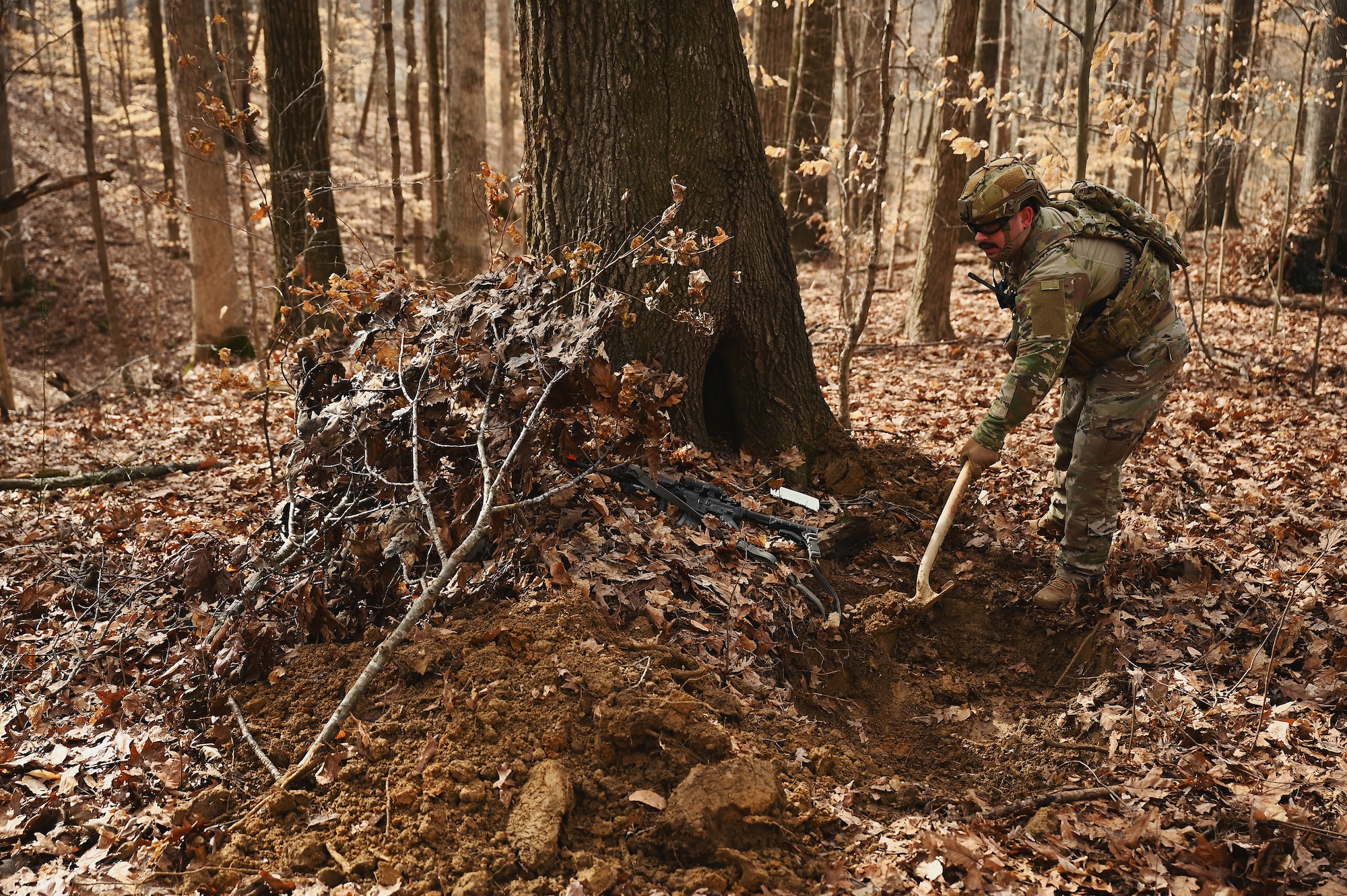 A U.S. Airman assigned to the 178th Security Forces Squadron, Ohio Air National Guard build defensive fighting positions Feb. 4, 2025 during annual training at Camp Holland in Butlerville, Indiana. The training focused on operational unpredictability enabled through the agility of forces across pre-postured locations, increasing the number of locations an adversary must target. (U.S. Air National Guard photo by Shane Hughes)