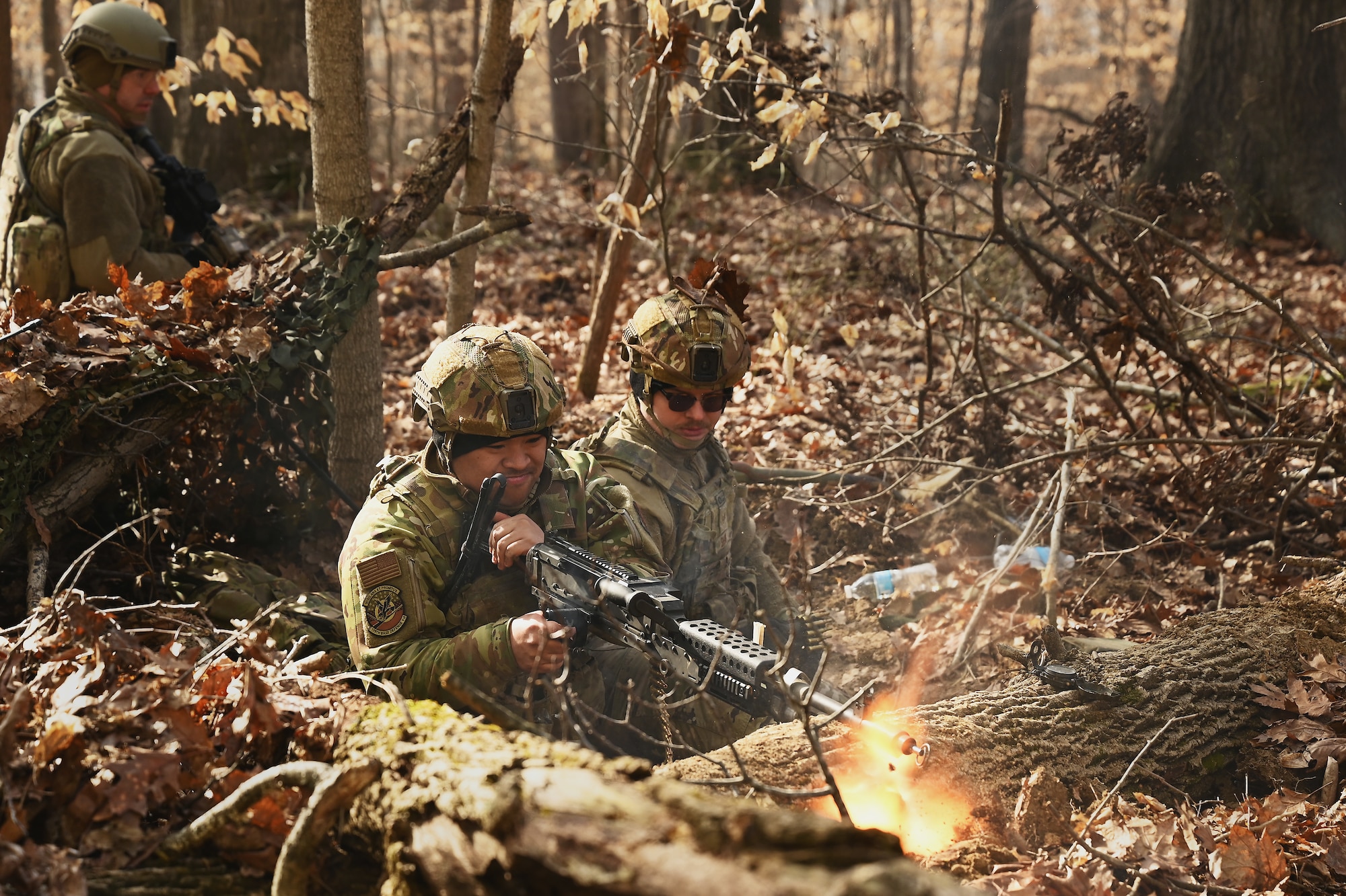 U.S. Airmen assigned to the 178th Security Forces Squadron, Ohio National Guard defend their fighting position against a simulated enemy attack Feb. 4, 2025 during annual training at Camp Holland in Butlerville, Indiana. The training, primarily focused on mission planning, included attacking and defending positions and aligning tactics with the Air Force doctrine of Agile Combat Employment. (U.S. Air National Guard photo by Shane Hughes)