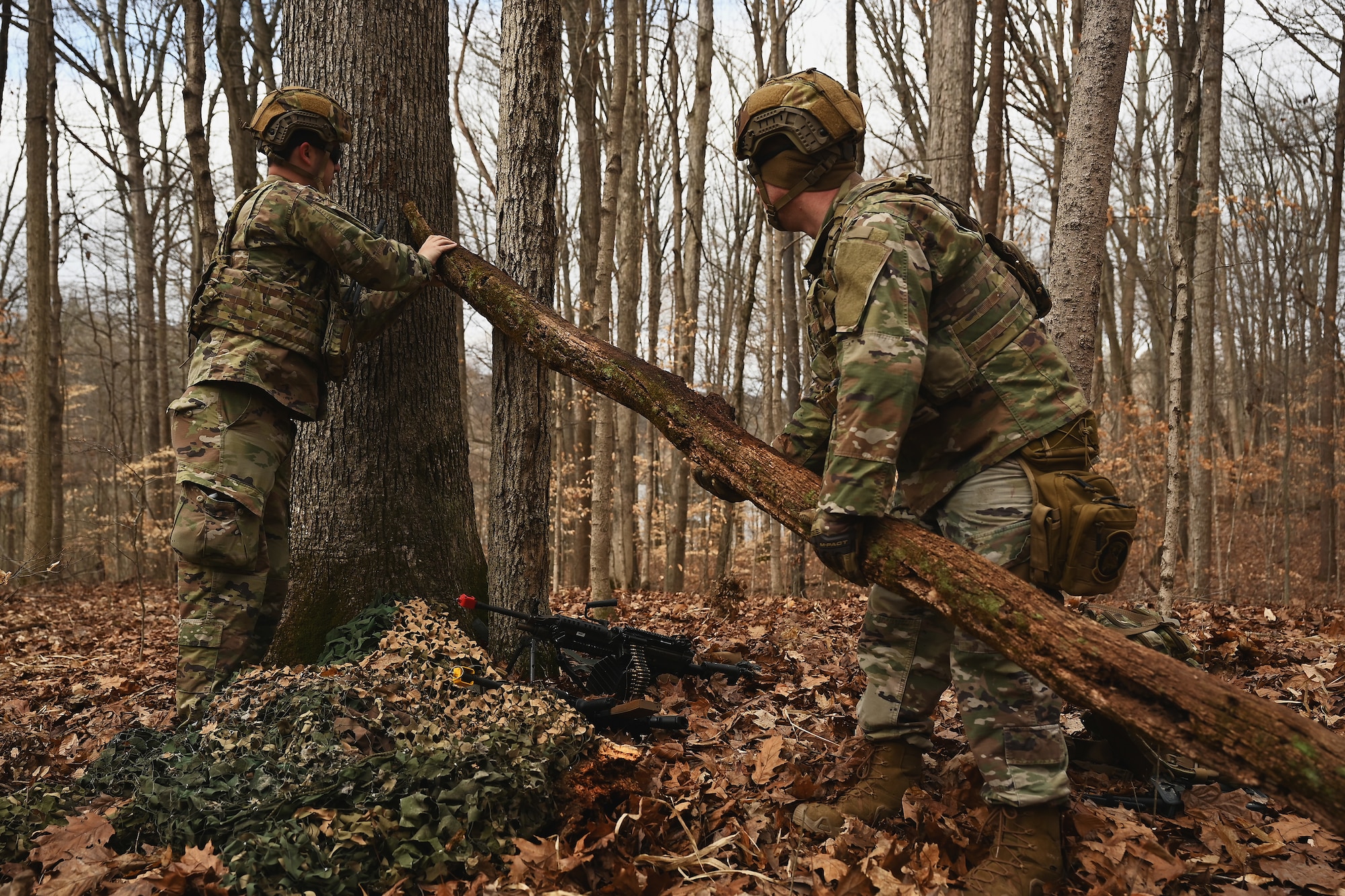 U.S. Airmen assigned to the 178th Security Forces Squadron, Ohio Air National Guard build defensive fighting positions Feb. 4, 2025 during annual training at Camp Holland in Butlerville, Indiana. The training focused on operational unpredictability enabled through the agility of forces across pre-postured locations, increasing the number of locations an adversary must target. (U.S. Air National Guard photo by Shane Hughes)
