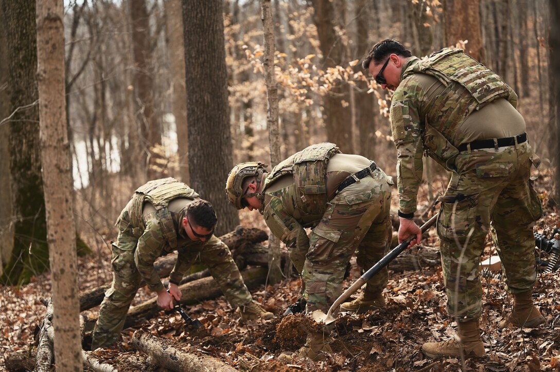 U.S. Airmen assigned to the 178th Security Forces Squadron, Ohio Air National Guard dig defensive fighting positions Feb. 3, 2025 during annual training at Camp Holland in Butlerville, Indiana. The training focused on operational unpredictability enabled through the agility of forces across pre-postured locations, increasing the number of locations an adversary must target. (U.S. Air National Guard photo by Shane Hughes)