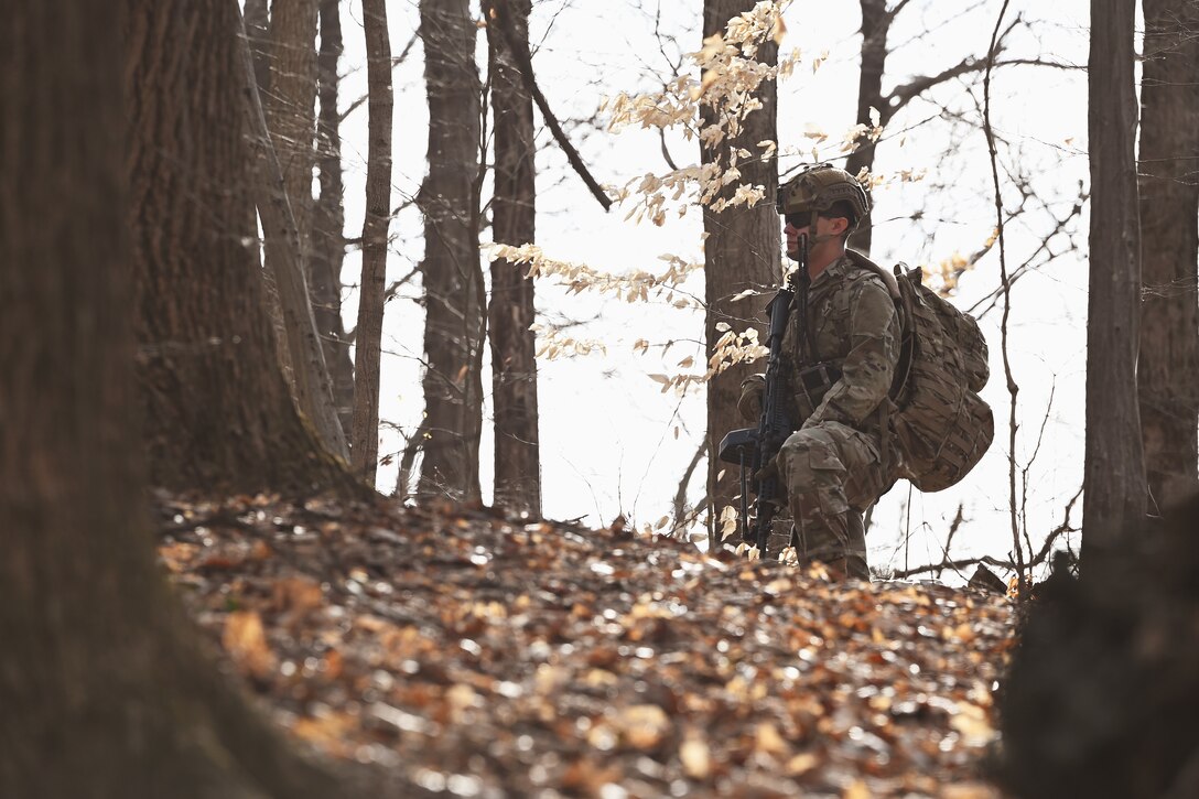 A U.S. Airmen assigned to the 178th Security Forces Squadron, Ohio Air National Guard provides security on a patrol Feb. 3, 2025 during annual training at Camp Holland in Butlerville, Indiana. The training, primarily focused on mission planning, helped Airmen develop a detailed understanding of the area of operations and how senior commanders envision winning the fight.(U.S. Air National Guard photo by Shane Hughes)