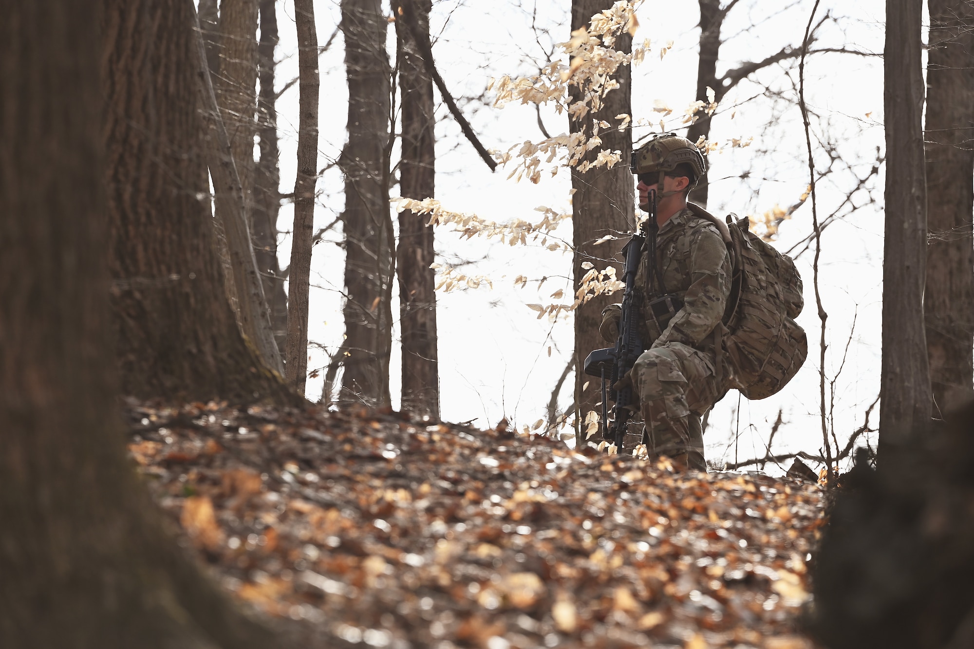 A U.S. Airmen assigned to the 178th Security Forces Squadron, Ohio Air National Guard provides security on a patrol Feb. 3, 2025 during annual training at Camp Holland in Butlerville, Indiana. The training, primarily focused on mission planning, helped Airmen develop a detailed understanding of the area of operations and how senior commanders envision winning the fight.(U.S. Air National Guard photo by Shane Hughes)