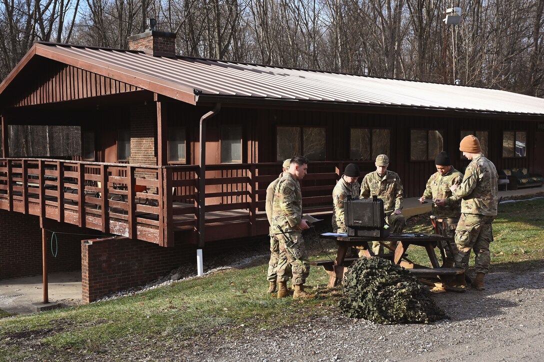 U.S. Air Force Tech. Sgt. Mark Staten, a security forces specialist assigned to the 178th Security Forces Squadron, Ohio Air National Guard, teaches a class on land navigation Feb. 2, 2025 during annual training at Camp Holland in Butlerville, Indiana. The training, primarily focused on mission planning, enhanced the skills that allow airmen to execute distributed operations that increase survivability while generating combat power. (U.S. Air National Guard photo by Shane Hughes)