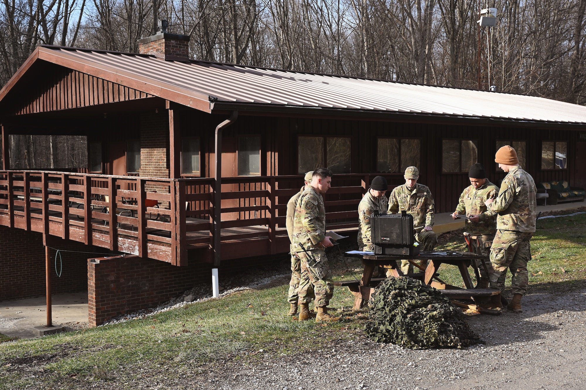 U.S. Air Force Tech. Sgt. Mark Staten, a security forces specialist assigned to the 178th Security Forces Squadron, Ohio Air National Guard, teaches a class on land navigation Feb. 2, 2025 during annual training at Camp Holland in Butlerville, Indiana. The training, primarily focused on mission planning, enhanced the skills that allow airmen to execute distributed operations that increase survivability while generating combat power. (U.S. Air National Guard photo by Shane Hughes)
