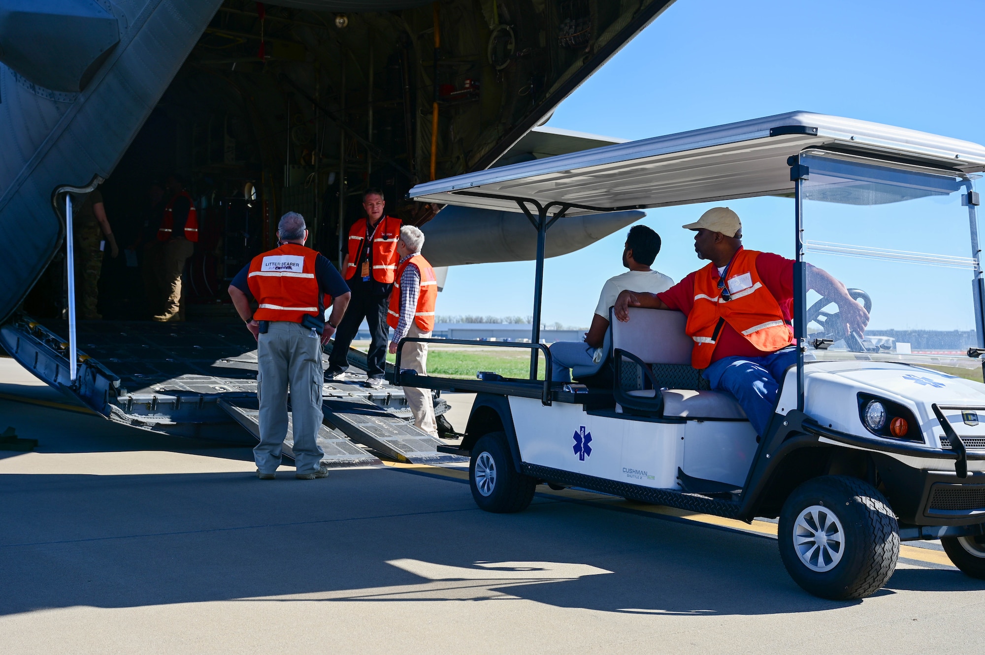 People prepare to transport a patient.