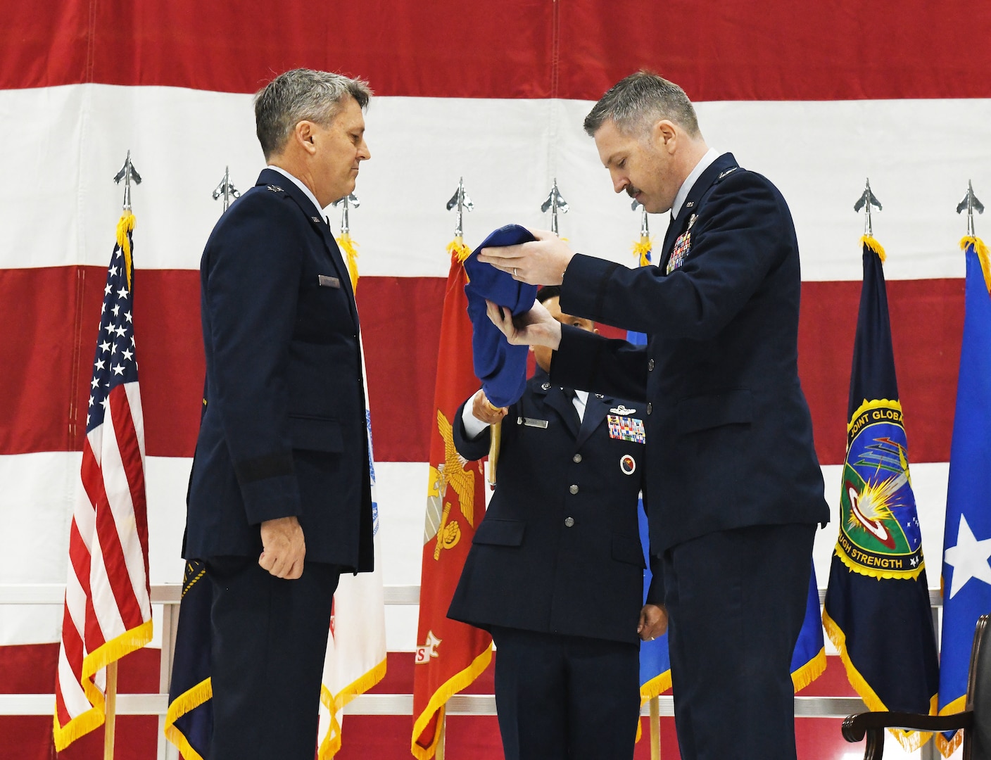 Col. Patrick Hook furls the 595th Command and Control Guidon